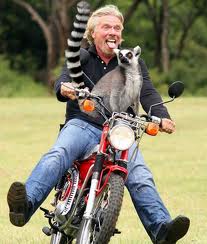 Branson on motorcycle with lemur
