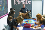 Officer and police dog in classroom 