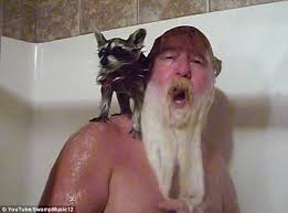 Man Showering with Pet Raccoon