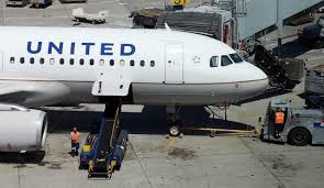 United Airline pays passenger to keep quiet about dog.