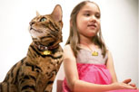 Cat and girl wearing matching SleppyPod pendants