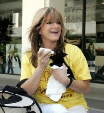 Susan Olsen feeding kitten